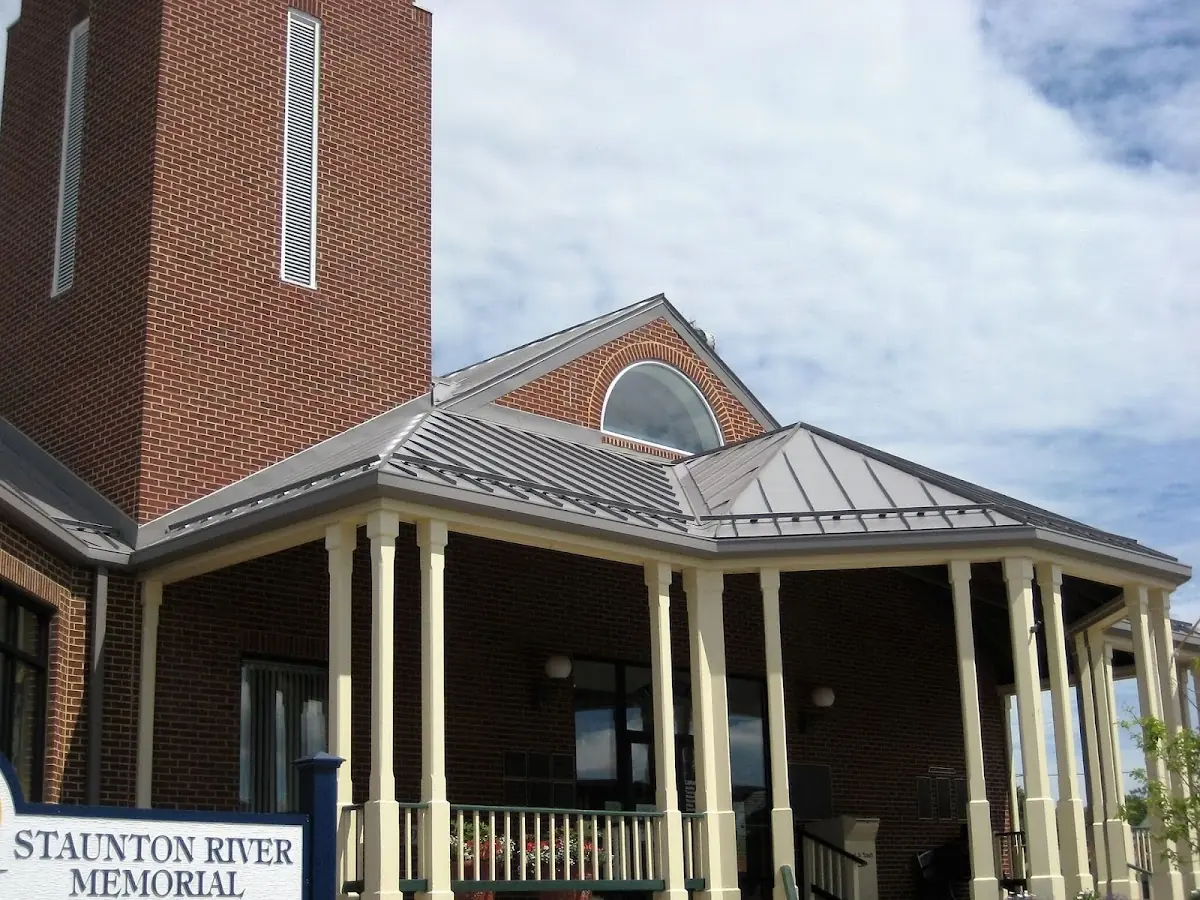 Skilled roofing craftsmen working on a residential roof in Gloucester